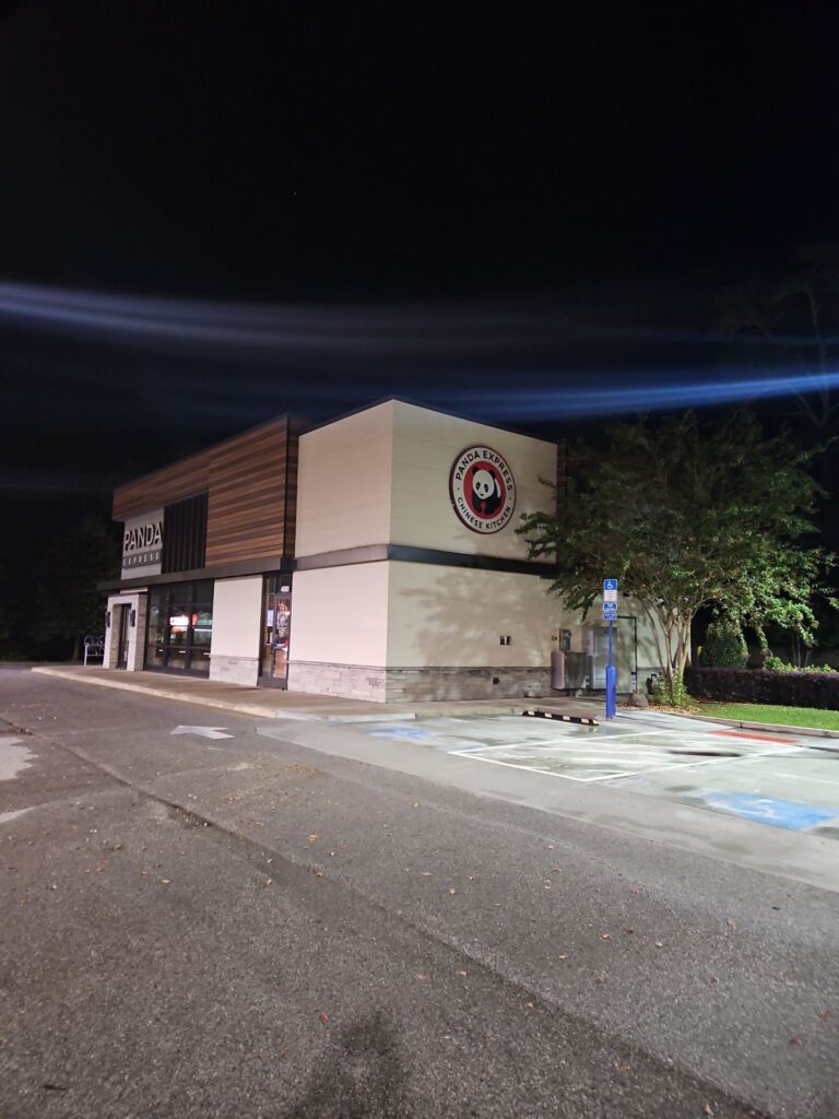 cleaning the exterior surfaces of a commercial building and surrounding pavement using pressure washing techniques