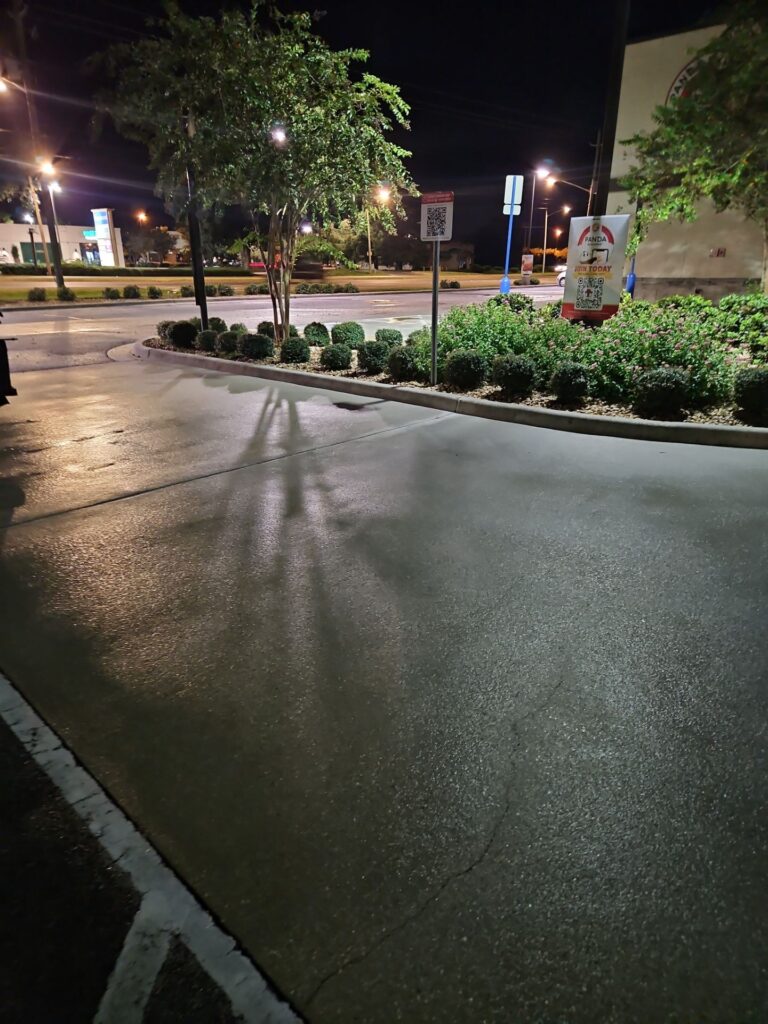 the service being done is pressure washing the concrete surface providing a clean and polished look to the area