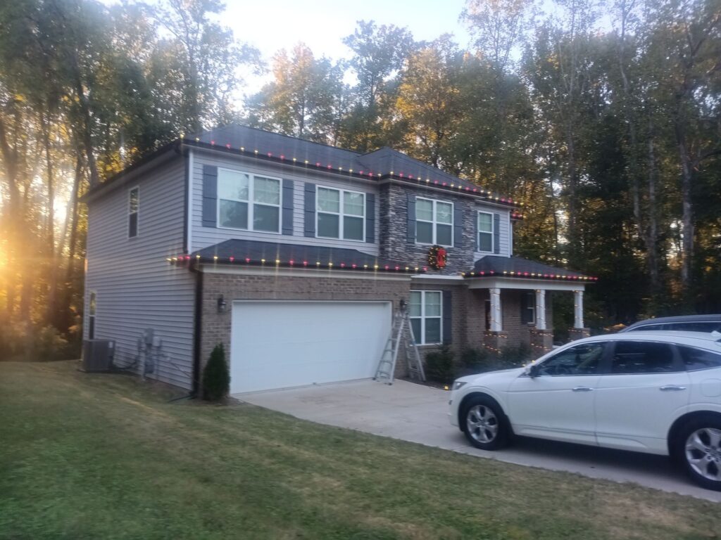 the service shown is likely roof cleaning and exterior house washing with pressure washing techniques applied to various surfaces